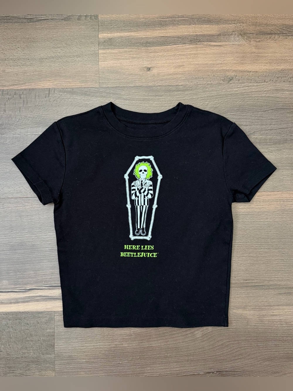 Beetlejuice Women's Black "Here Lies Beetlejuice" Graphic Baby Tee Size Small